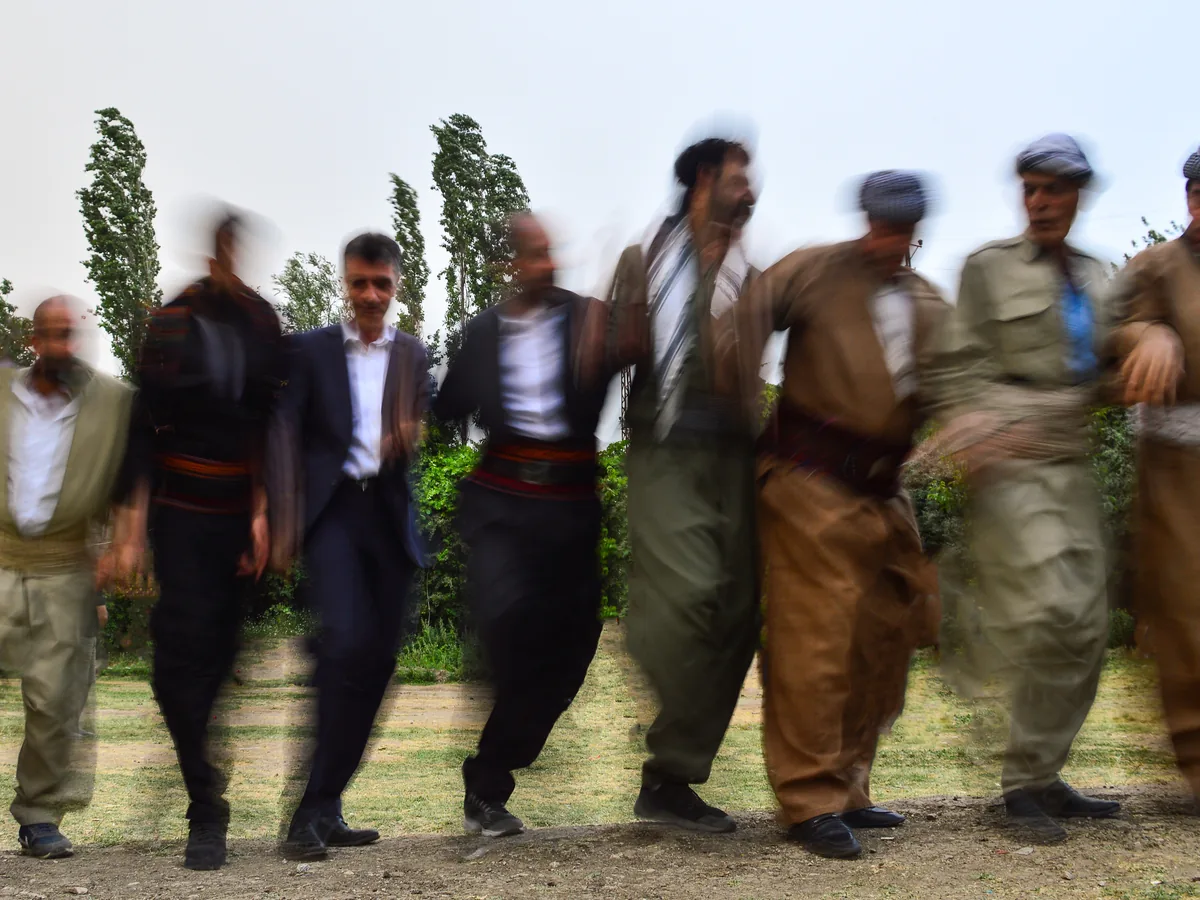 A line of dancers performing a traditional Anatolian dance